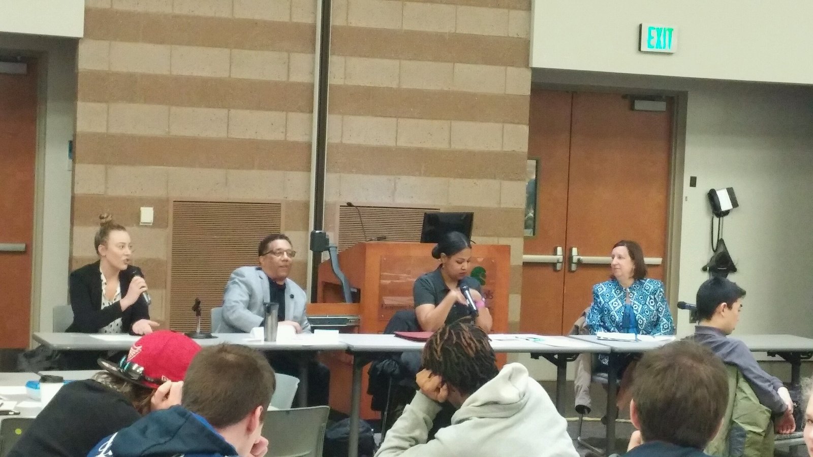 Raquel Ne’Cole speaking on a panel to a room of students